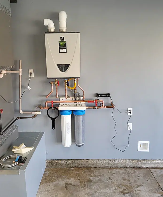 Tankless water heater and whole-house filtration system installed in garage in Rancho Cucamonga CA