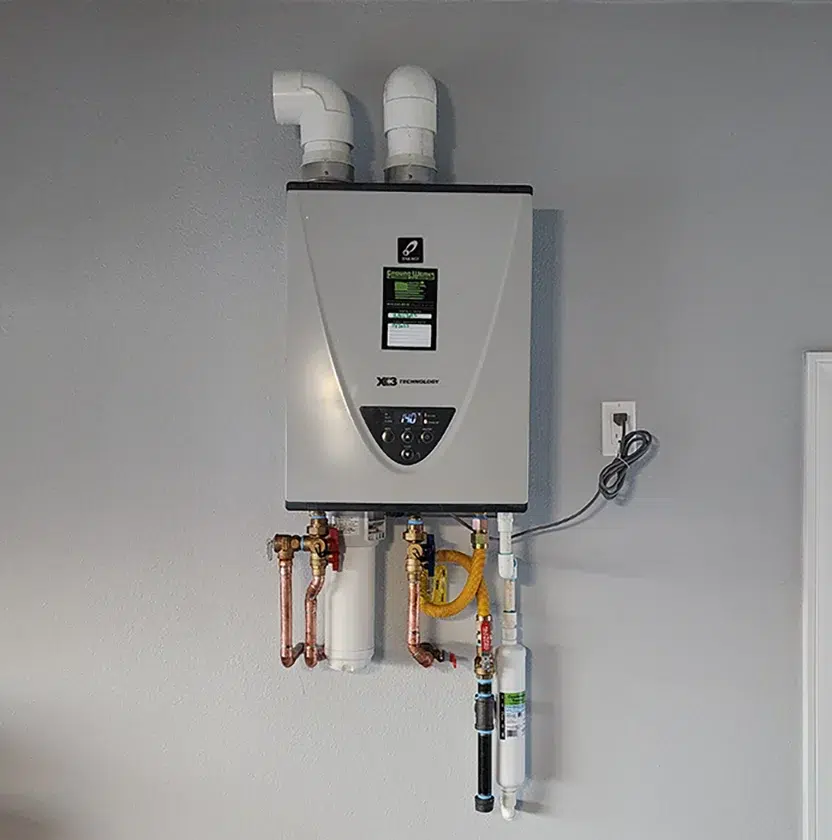 Wall-mounted tankless water heater with copper piping in Rancho Cucamonga CA